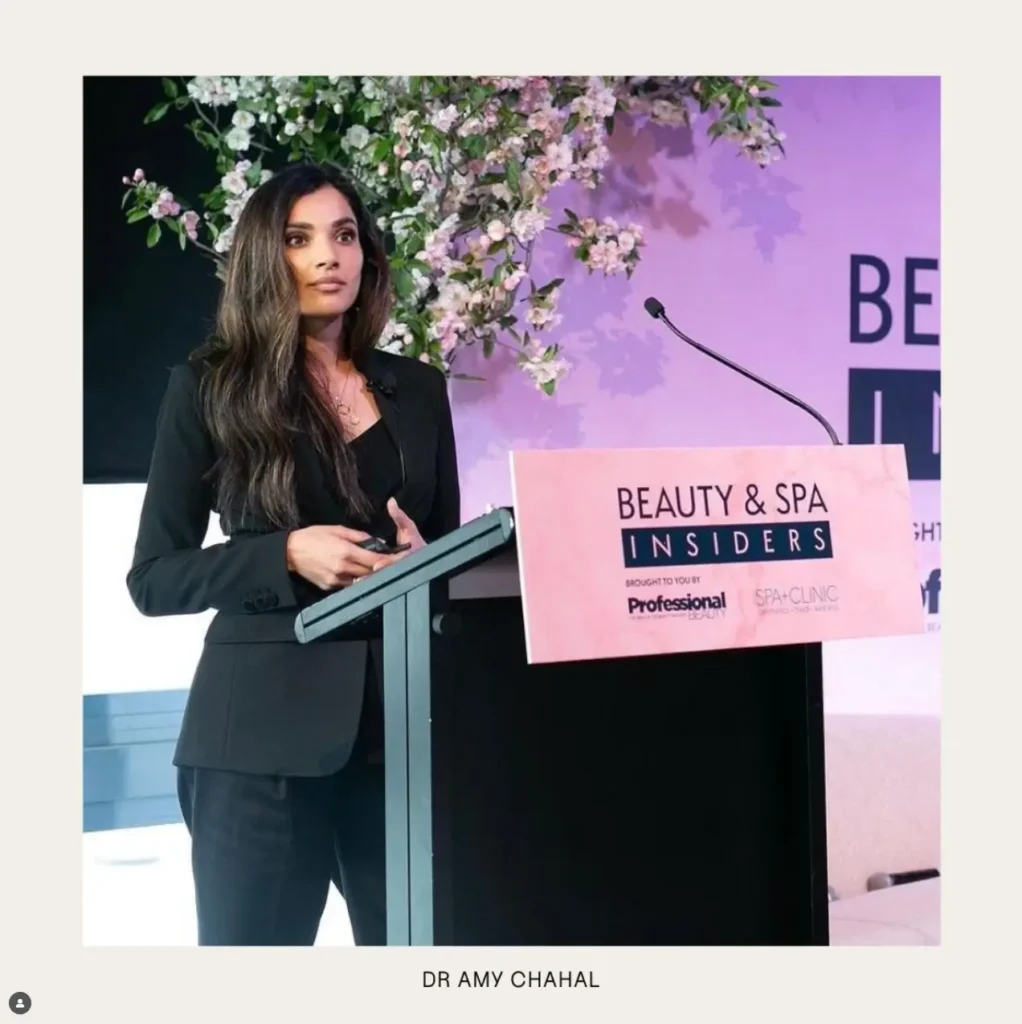 Dr Amy Chahal presenting to practitioners on medical aesthetic practice